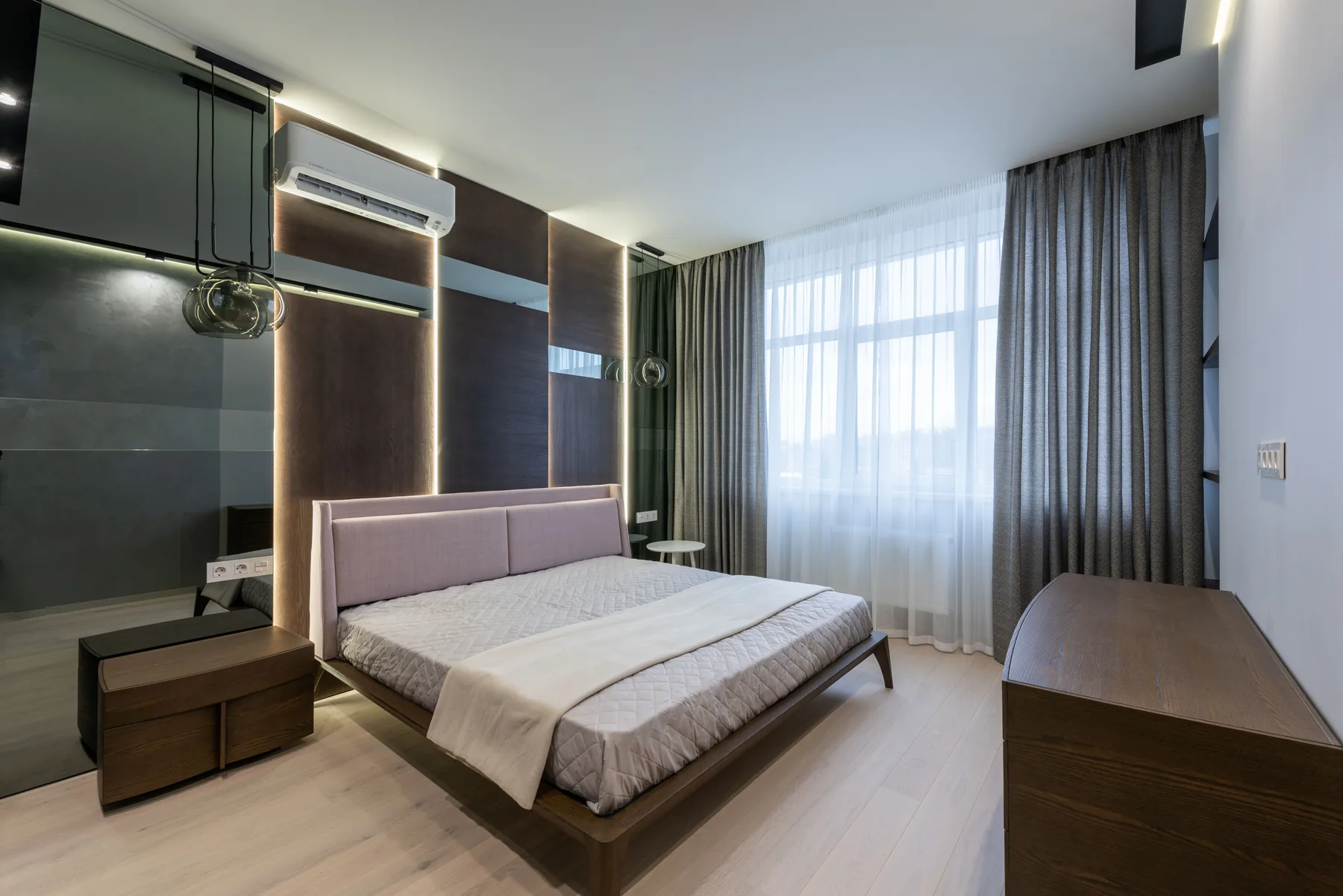 Contemporary bedroom with warm solid wood furniture and natural textures