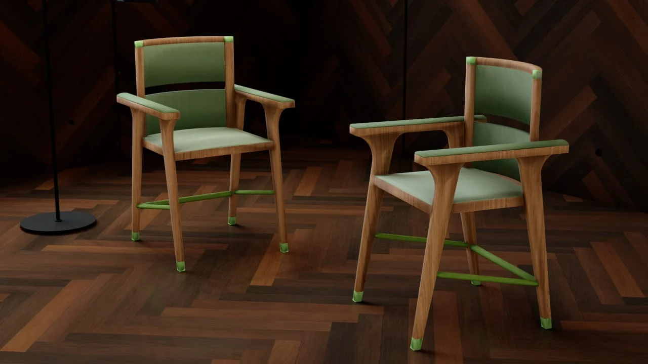 Pair of custom solid wood armchairs with green upholstery displayed in a dark wood interior