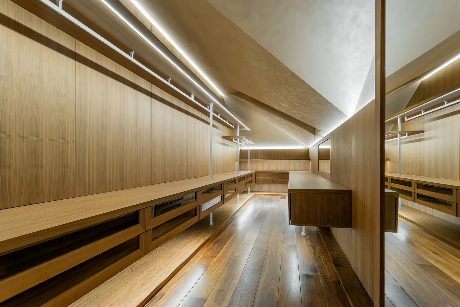 Premium walk-in wardrobe with solid wood cabinetry and organised storage