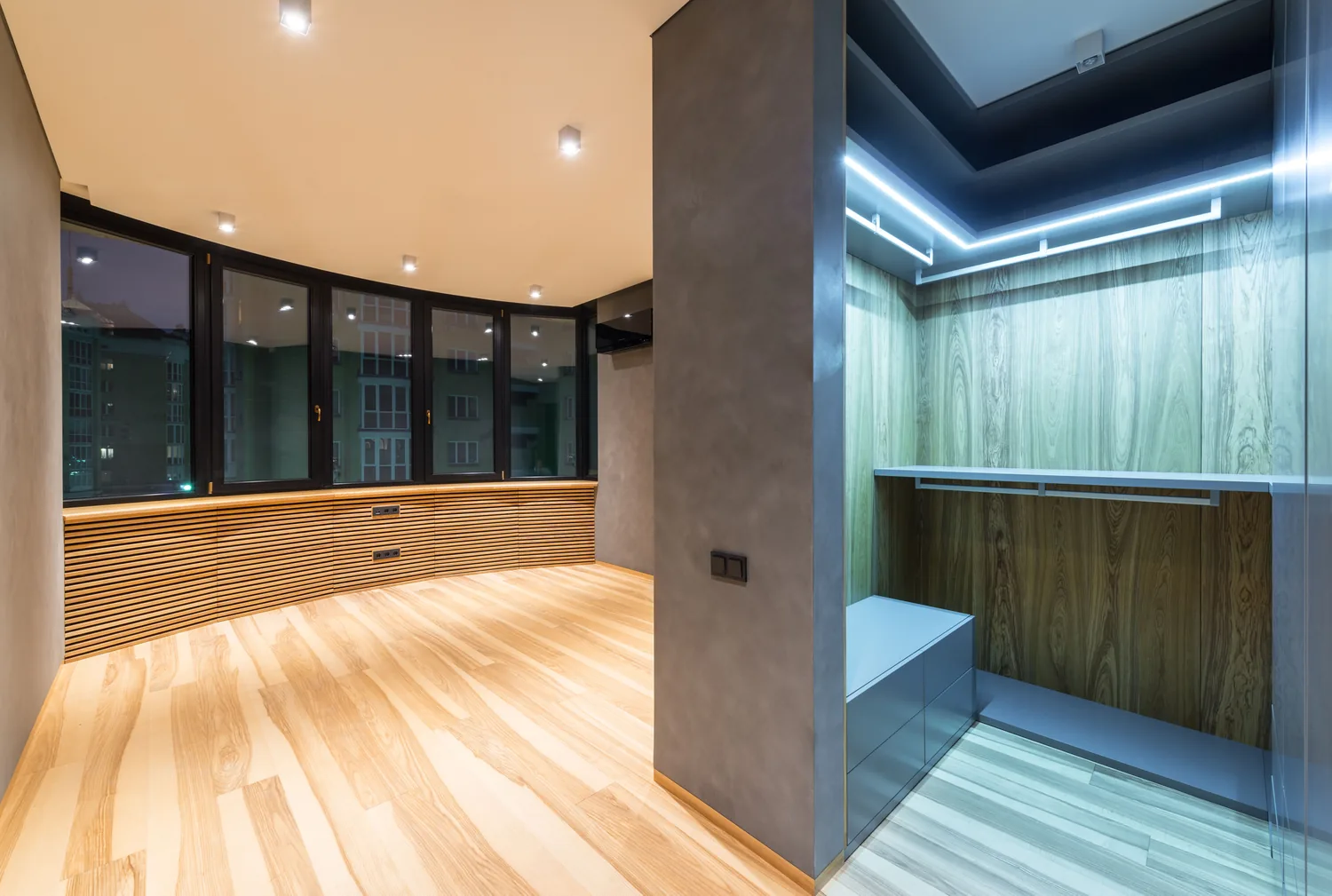 Modern room with a large custom wooden wardrobe and carefully coordinated finish