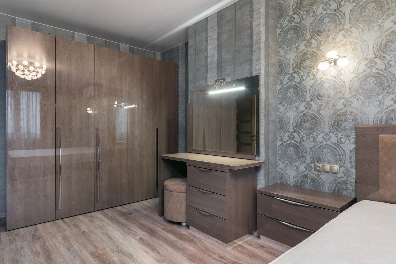 Bedroom with coordinated wooden wardrobe and dresser storage